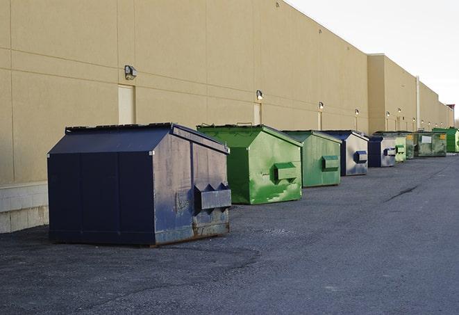 a collection of bright and vibrant dumpsters in a construction zone in Cheshire, OH